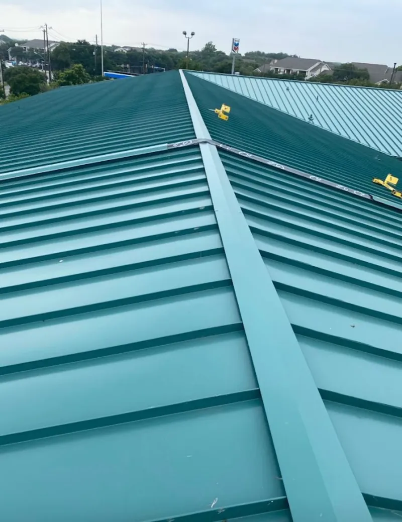Green commercial metal roof ridge and valley for Metal Roof Repair in Vadnais Heights