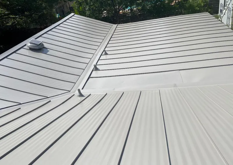 Solar attic fan installed on a metal roof for Roof Ventilation in Vadnais Heights